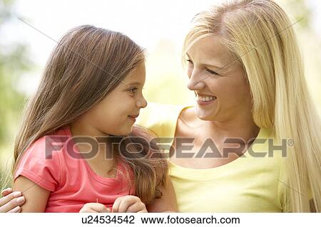 Portrait Of Mother And Daughter In Park View Large Photo Image Stock Image - Portrait Of Mother And Daughter In Park. Fotosearch