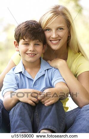 Stock Image - Portrait Of Mother And Son In Park. Fotosearch