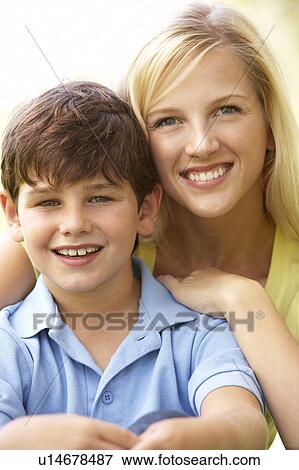 Stock Photo - Portrait Of Mother And Son In Park. Fotosearch