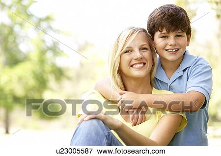 Stock Photo - Portrait Of Mother And Son In Park. Fotosearch