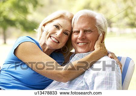 Stock Image - Portrait Of Senior Couple Enjoying Day In Park. Fotosearch
