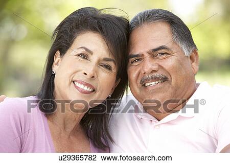 Stock Image - Portrait Of Senior Couple In Park. Fotosearch