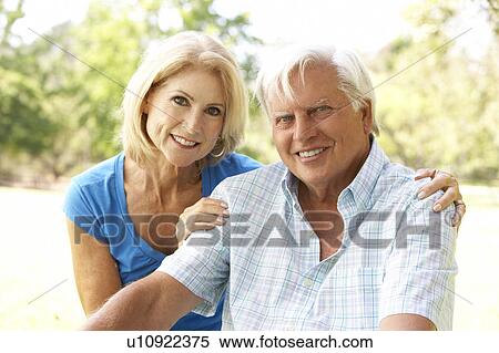 Stock Photography - Portrait Of Senior Couple In Park. Fotosearch