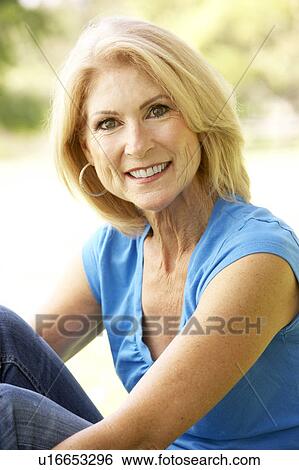 Stock Photograph - Portrait Of Senior Woman In Park. Fotosearch