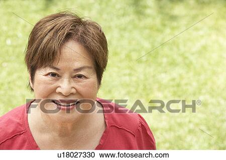 Portrait Of Smiling Senior Woman Outdoors View Large Photo Image Stock Image - Portrait Of Smiling Senior Woman Outdoors. Fotosearch