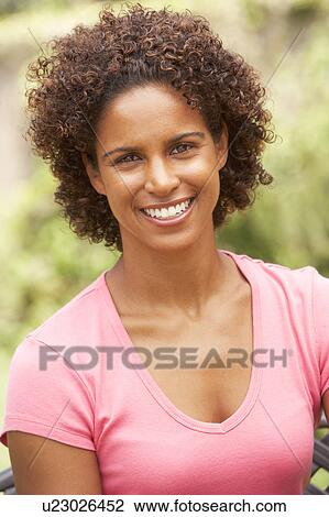 Stock Image - Portrait Of Smiling Young Woman. Fotosearch