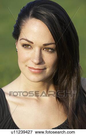 Stock Photo - Portrait Of Woman In Summer Field. Fotosearch