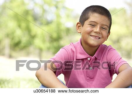 Portrait Of Young Boy In Park View Large Photo Image Stock Photo - Portrait Of Young Boy In Park. Fotosearch