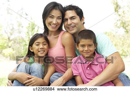 Portrait Of Young Family In Park View Large Photo Image Picture - Portrait Of Young Family In Park. Fotosearch