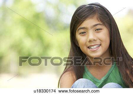Picture - Portrait Of Young Girl In Park. Fotosearch