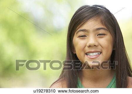 Portrait Of Young Girl In Park View Large Photo Image Stock Image - Portrait Of Young Girl In Park. Fotosearch