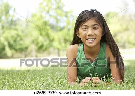 Portrait Of Young Girl In Park View Large Photo Image Stock Photo - Portrait Of Young Girl In Park. Fotosearch