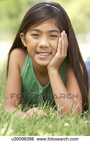 Portrait Of Young Girl In Park View Large Photo Image Stock Photo - Portrait Of Young Girl In Park. Fotosearch