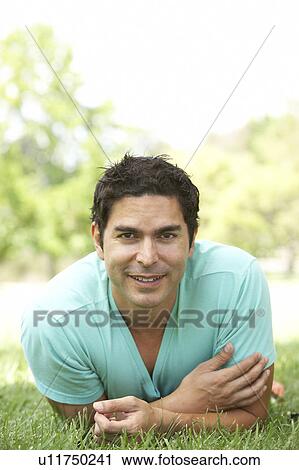 Stock Image - Portrait Of Young Man In Park. Fotosearch
