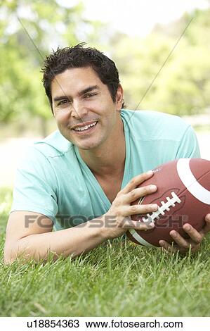 Portrait Of Young Man In Park With American Football View Large Photo Image Stock Image - Portrait Of Young Man In Park With American Football. Fotosearch