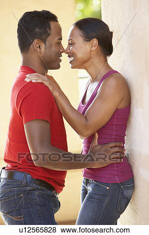 Stock Photo - Romantic Young Couple Outside Building. Fotosearch