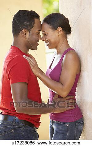 Stock Photograph - Romantic Young Couple Outside Building. Fotosearch