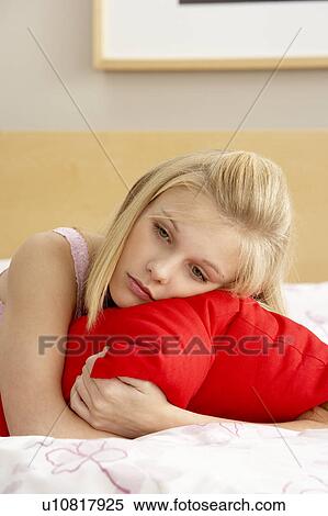 Sad Teenage Girl In Bedroom Hugging Pillow View Large Photo Image Stock Photography - Sad Teenage Girl In Bedroom Hugging Pillow. Fotosearch