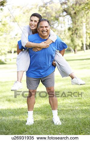 Senior Couple In Sports Clothing Having Fun In Park View Large Photo Image Stock Photography - Senior Couple In Sports Clothing Having Fun In Park. Fotosearch