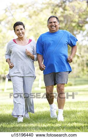 Senior Couple Jogging In Park View Large Photo Image Stock Image - Senior Couple Jogging In Park. Fotosearch