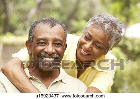 Stock Photo - Senior Couple Outdoors Hugging. Fotosearch