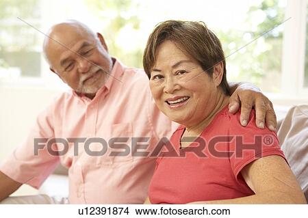 Picture - Senior Couple Relaxing At Home Together. Fotosearch
