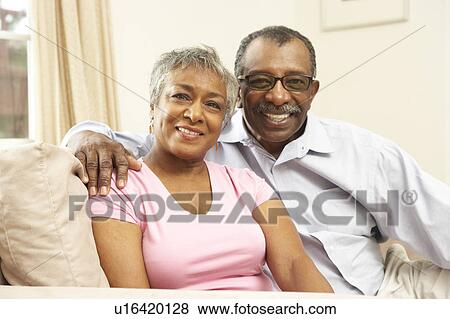 Stock Photo - Senior Couple Relaxing At Home Together. Fotosearch