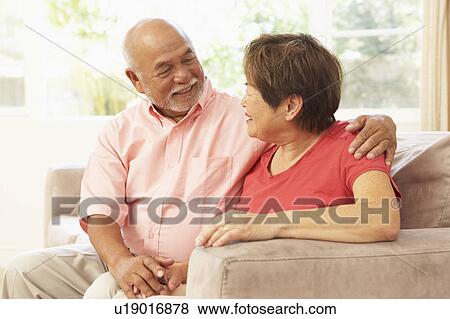 Stock Photo - Senior Couple Relaxing At Home Together. Fotosearch