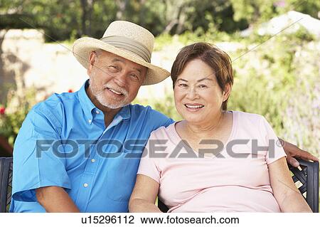 Senior Couple Relaxing In Garden Together View Large Photo Image Stock Image - Senior Couple Relaxing In Garden Together. Fotosearch