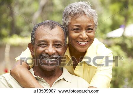 Senior Couple Relaxing In Garden View Large Photo Image Stock Photo - Senior Couple Relaxing In Garden. Fotosearch