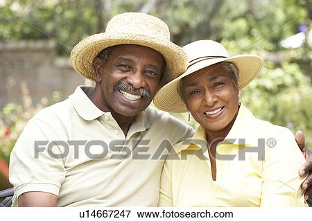 Senior Couple Relaxing In Garden Together View Large Photo Image Stock Photo - Senior Couple Relaxing In Garden Together. Fotosearch
