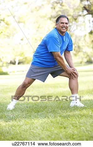 Picture - Senior Man Exercising In Park. Fotosearch