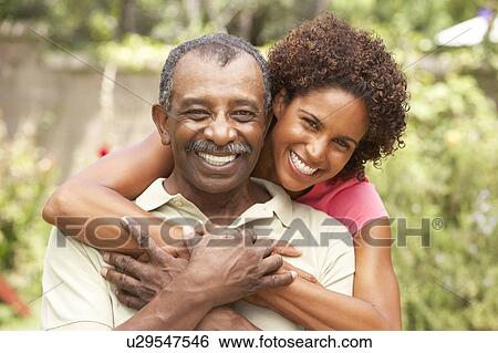 Senior Man Hugging Adult Daughter View Large Photo Image Stock Photograph - Senior Man Hugging Adult Daughter. Fotosearch