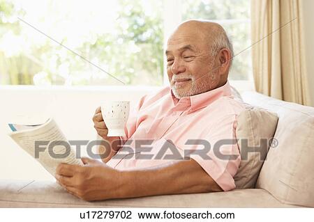 Senior Man Reading Book With Drink At Home View Large Photo Image Stock Image - Senior Man Reading Book With Drink At Home. Fotosearch