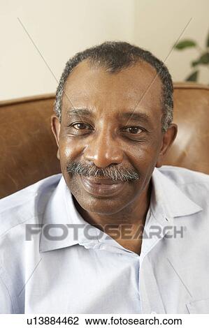Senior Man Relaxing In Chair At Home View Large Photo Image Stock Image - Senior Man Relaxing In Chair At Home. Fotosearch