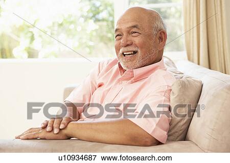 Senior Man Relaxing In Chair At Home View Large Photo Image Stock Photo - Senior Man Relaxing In Chair At Home. Fotosearch
