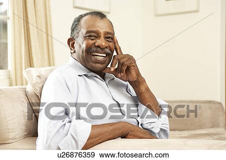 Senior Man Relaxing In Chair At Home View Large Photo Image Stock Photo - Senior Man Relaxing In Chair At Home. Fotosearch