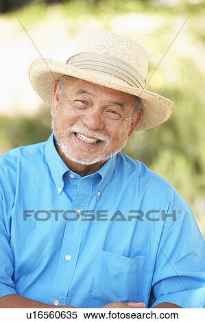 Stock Photography - Senior Man Relaxing In Garden. Fotosearch