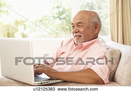 Senior Man Using Laptop At Home View Large Photo Image Stock Image - Senior Man Using Laptop At Home. Fotosearch