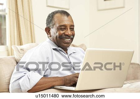 Senior Man Using Laptop At Home View Large Photo Image Stock Image - Senior Man Using Laptop At Home. Fotosearch