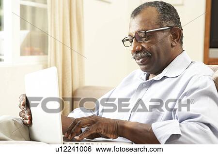 Senior Man Using Laptop At Home View Large Photo Image Stock Photograph - Senior Man Using Laptop At Home. Fotosearch