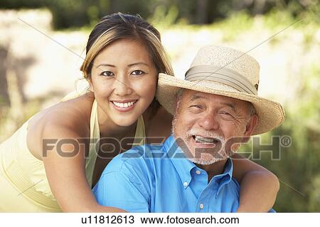 Senior Man With Adult Daughter In Garden View Large Photo Image Stock Image - Senior Man With Adult Daughter In Garden. Fotosearch