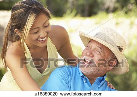 Senior Man With Adult Daughter In Garden View Large Photo Image Stock Image - Senior Man With Adult Daughter In Garden. Fotosearch