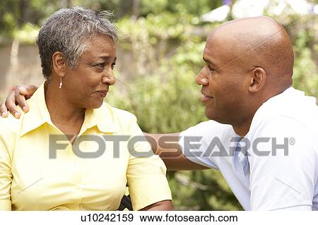 Senior Woman Being Consoled By Adult Son View Large Photo Image Stock Photo - Senior Woman Being Consoled By Adult Son. Fotosearch