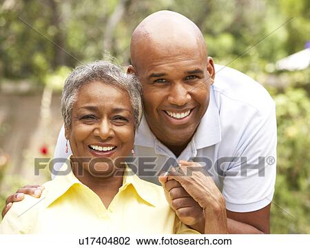 Senior Woman Being Hugged By Adult Son View Large Photo Image Stock Image - Senior Woman Being Hugged By Adult Son. Fotosearch