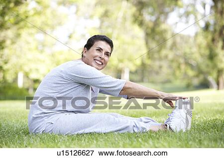 Senior Woman Exercising In Park View Large Photo Image Stock Photo - Senior Woman Exercising In Park. Fotosearch