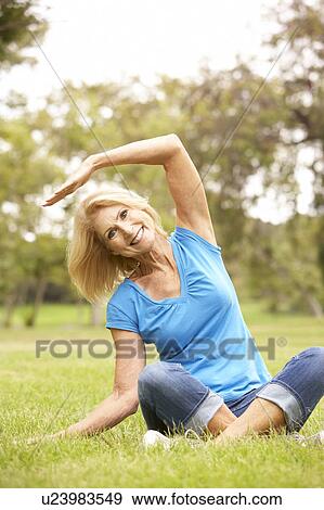 Senior Woman Exercising In Park View Large Photo Image Stock Photo - Senior Woman Exercising In Park. Fotosearch