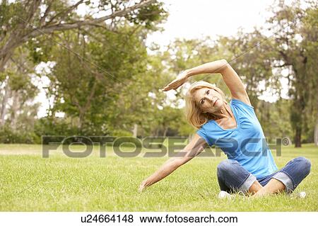 Stock Photo - Senior Woman Exercising In Park. Fotosearch