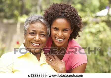 Senior Woman Hugging Adult Daughter View Large Photo Image Stock Photo - Senior Woman Hugging Adult Daughter. Fotosearch