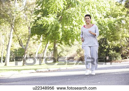 Senior Woman Jogging In Park View Large Photo Image Stock Photograph - Senior Woman Jogging In Park. Fotosearch